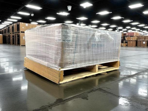New in box American Range AERB-36 gas charbroiler, 36" wide, six burners, wrapped on a pallet, in a warehouse.