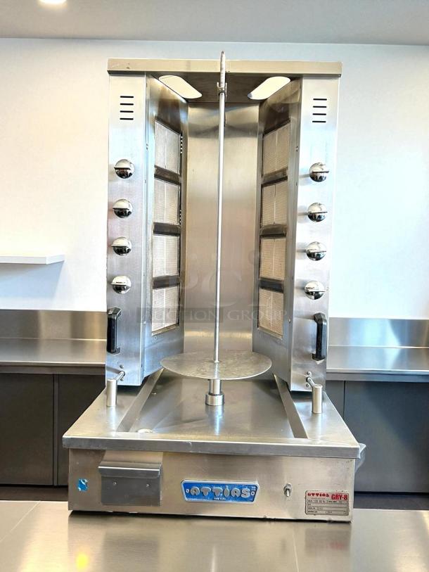 Attias GRY-8 electric gyro machine, 8 burners, 100 lbs capacity, excellent condition, 120v/60hz/1ph, tested and working.