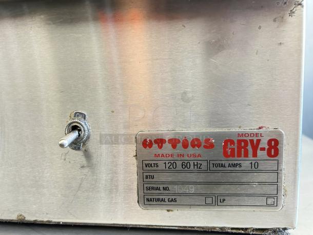 Attias GRY-8 electric gyro machine, 8 burners, 100lbs capacity, label showing model, 120V, 60Hz, 10 amps, USA made.