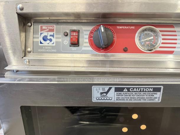 Metro C563L-SFC-L C5 6 Series heated holding cabinet with clear doors, temperature controls, and caution label; tested & working.
