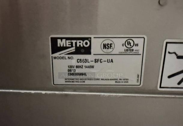 Metro C563L-SFC-L tag showing model, 120V 60Hz 1440W, NSF and UL listed marks, made in USA by InterMetro.