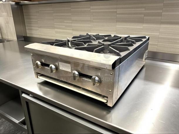 Stratus AEHP-4-24 gas range, 24", 4 burners, stainless steel. Great condition, tested and working, with control knobs.