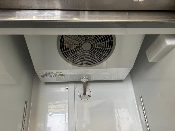 Interior view of Avantco A-19F-HC 29" reach-in freezer in like-new condition, showing fan and stainless steel interior.