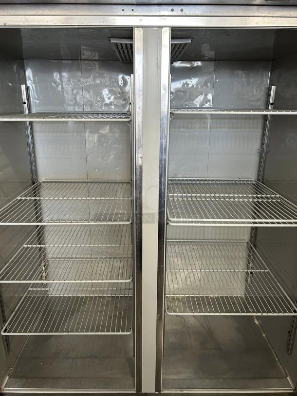 Delfield GBR2P-S two-section reach-in refrigerator, 55.2", solid left/right hinge doors, shelves inside, tested and working.