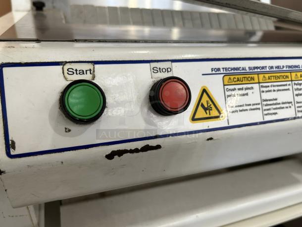 Oliver 732-N front-load bread slicer, like new condition, features start/stop buttons, caution labels, tested and working.