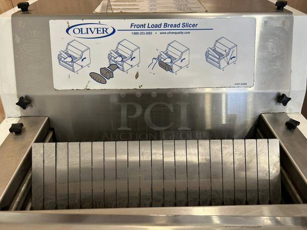 Oliver 732-N front-load bread slicer, like new condition, stainless steel, with bagging scoop. Tested and working, 115v.