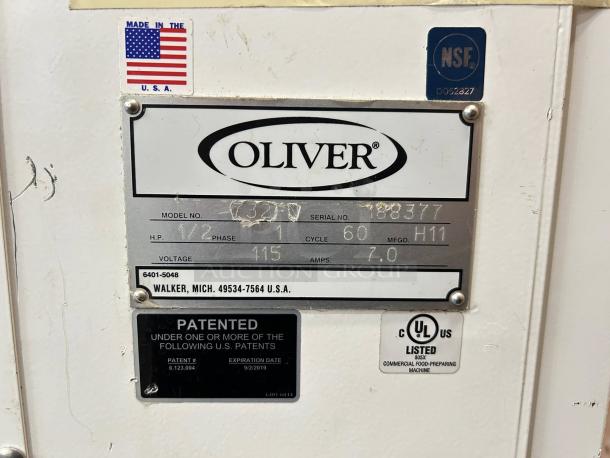 Oliver 732-N front-load bread slicer, like new, with bagging scoop. Model and serial plate details visible. 115v, tested and working.