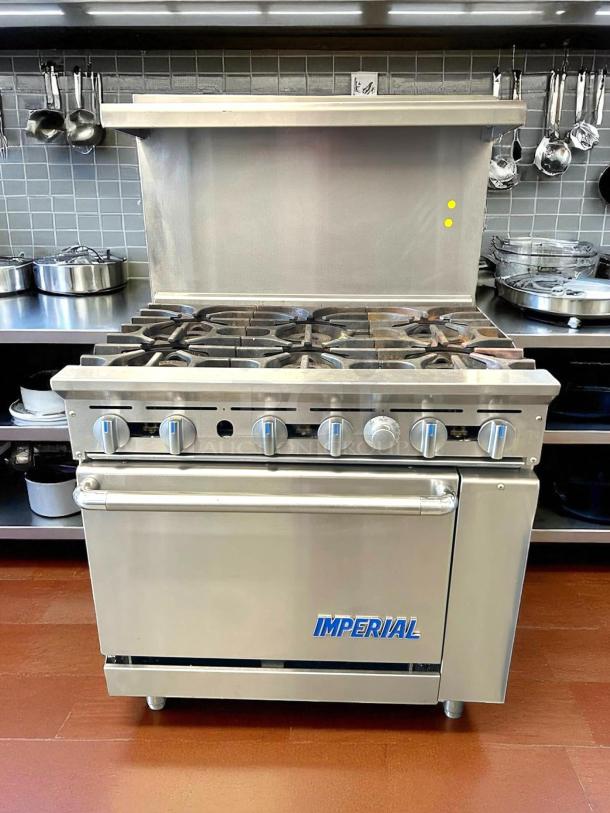 Immaculate Imperial IR-6NG Pro Series 36" gas range, 6 burners, 26.5" oven, 227,000 BTU, tested, with "Imperial" logo.