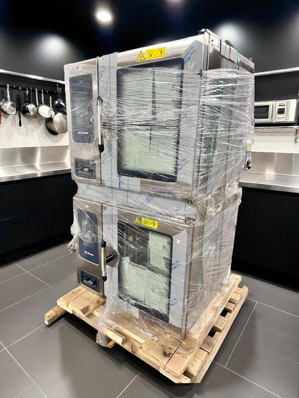 Brand new Alto-Shaam 7-20G PRO double full-size combi-oven, boilerless, natural gas, wrapped and palletized, in kitchen setting.