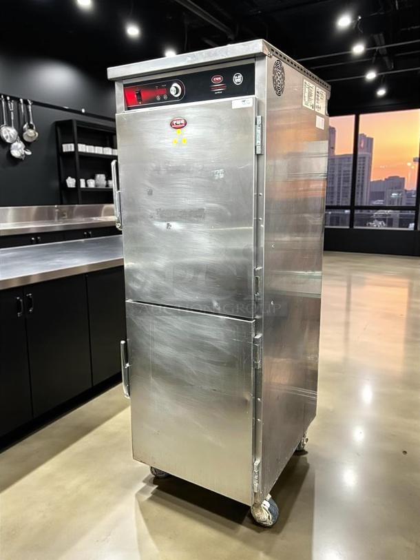 FWE UHST-13 mobile heated holding cabinet, stainless steel, 13 pan capacity, 120V, solid door, used condition, on casters.