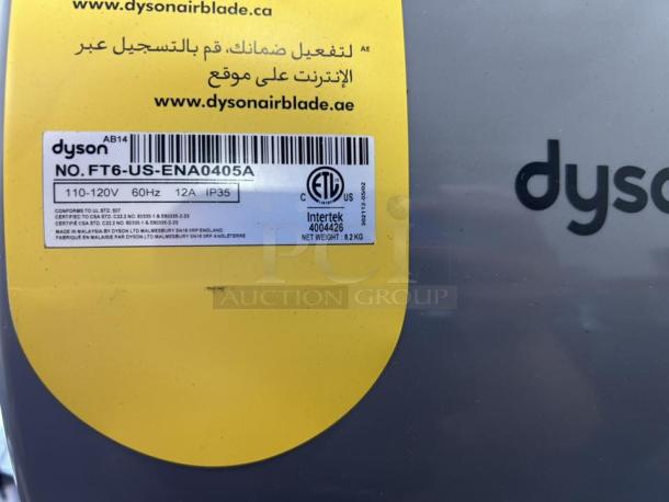 Silver Dyson Airblade hand dryer model 13043-01, perfect condition, tested and working. Label indicates 110-120V, 12A, IP35.