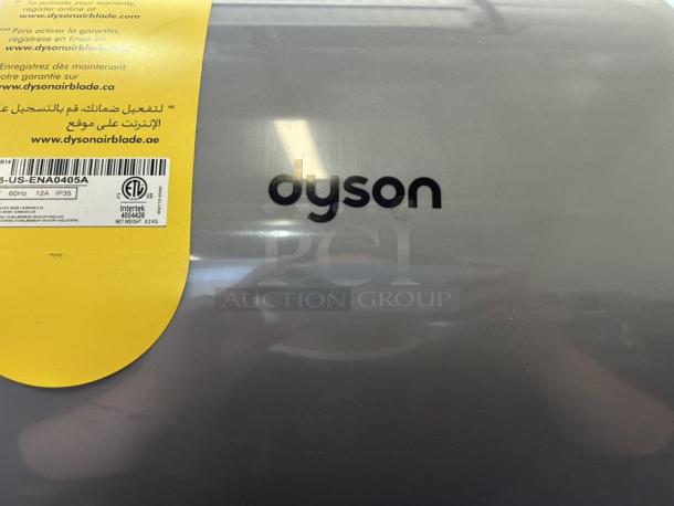 Dyson Airblade hand dryer, model 13043-01, in perfect condition. Silver color, with visible tags and branding. Tested and working.