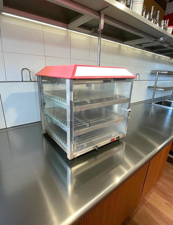 Tomlinson Industries 513FC Fusion Pizza and Snack Merchandiser with three heated shelves, in excellent condition, 120v, tested.