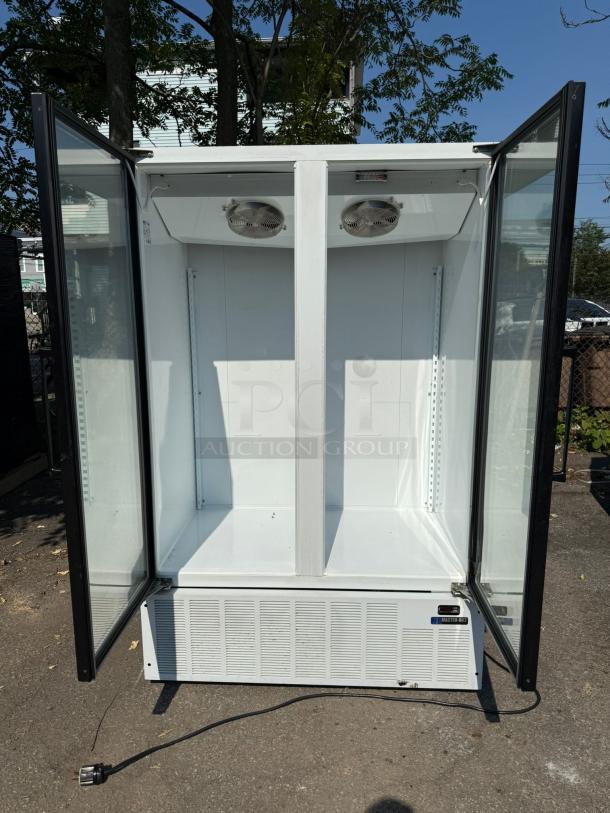 Master-Bilt BLG-48HD 2 Door Glass Freezer Merchandiser, clean interior, open doors, visible vents, plug included.