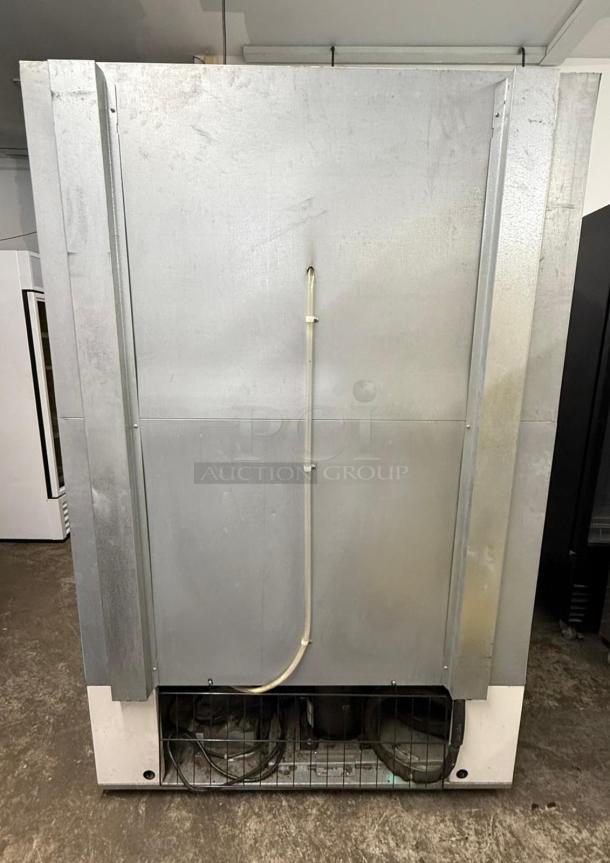 Master-Bilt BLG-48HD 2 Door Glass Freezer Merchandiser, rear view, sturdy construction, used condition. Model BLG-48HD.
