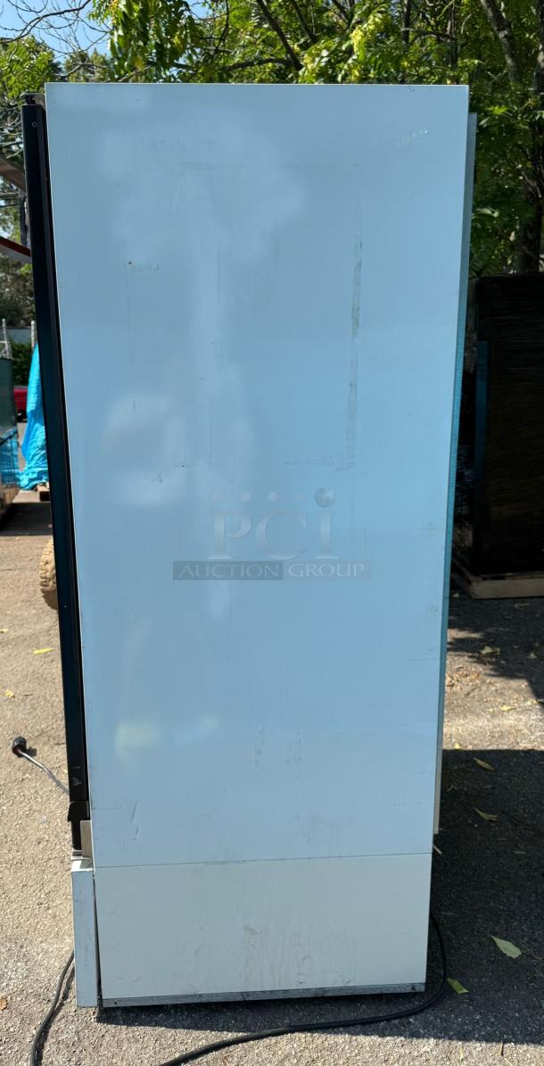 Master-Bilt BLG-48HD glass freezer merchandiser, two doors, visible signs of wear, power cord attached.