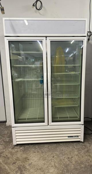 TRUE FLM-54F-TSL01 freezer merchandiser, two glass doors, shelves visible, good condition, True brand label.