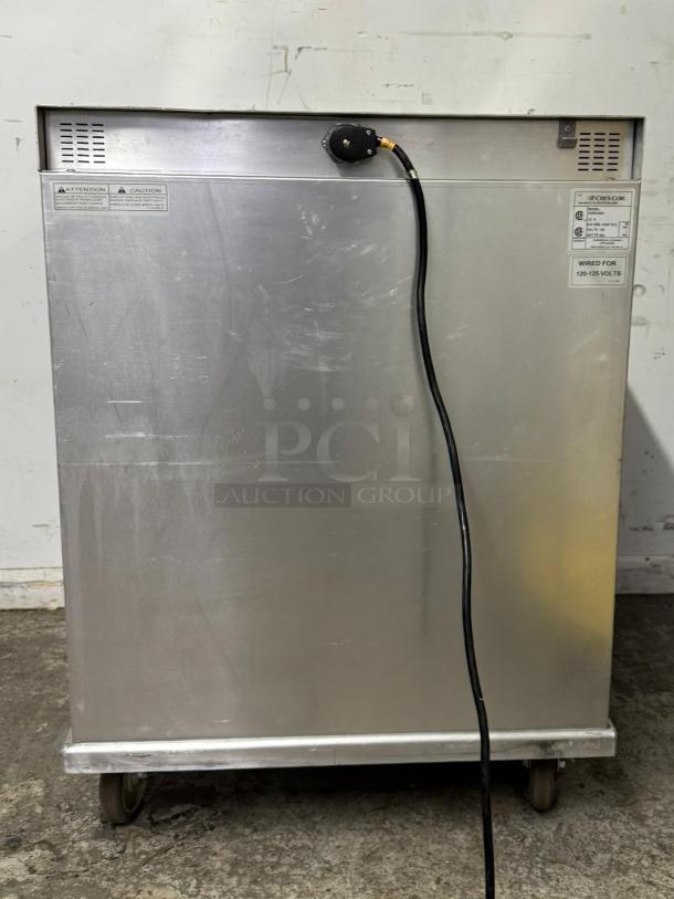 CRESCOR H339U8AC insulated mobile heated cabinet, 8-pan capacity, shows power cord, 120v label, stainless steel, on wheels.