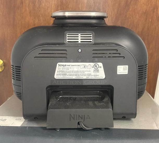 Ninja FG551 Foodi Smart XL 6-in-1 Indoor Grill. Black, UL listed, rear label with model and safety info visible.