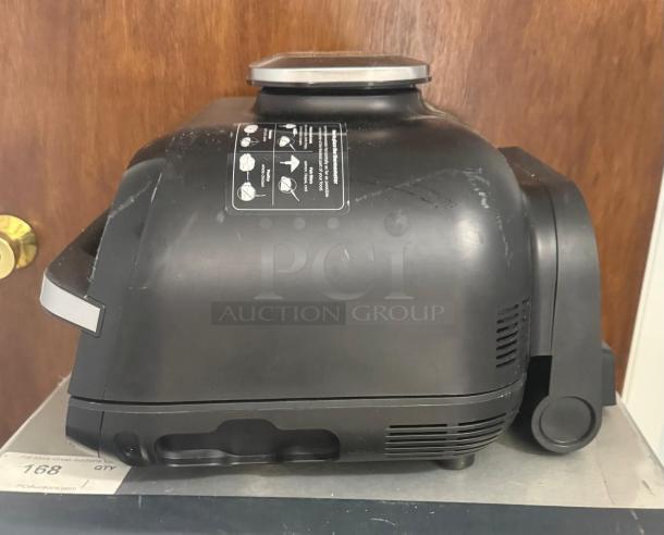 Ninja FG551 Foodi Smart XL Indoor Grill, 6-in-1, black, visible wear, side view, model instruction sticker attached.