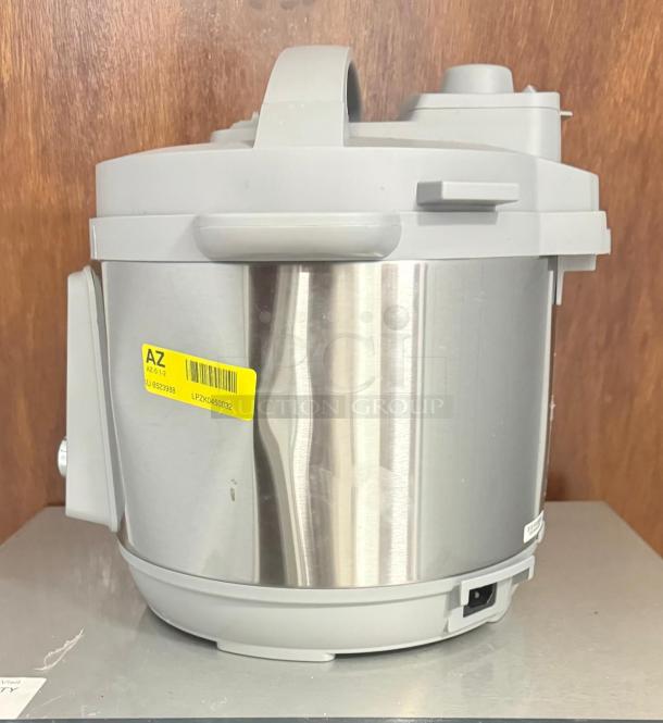 Instant Pot Pro Multi-Use Pressure Cooker, white, model LPZK0450032, stainless steel, minor scuffs, visible label with model info.