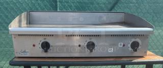 Toastmaster 36" gas griddle with thermostatic control, stainless steel, used condition, visible dials and Pro-Series label.