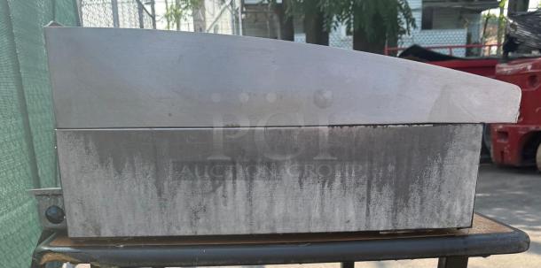 Toastmaster 36" gas griddle with thermostatic control, stainless steel, used condition, showing wear on surface.