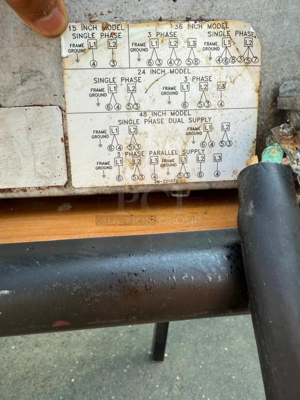 Toastmaster Countertop Flat Grill 36" with Thermostatic Control. Gas griddle label shows wiring diagrams. Moderate wear visible.