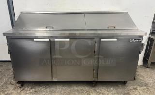 Leader commercial undercounter 3-door refrigerator lowboy fridge. Stainless steel, used condition, front view.