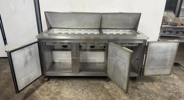 Leader Commercial Undercounter 3 Door Refrigerator Lowboy, stainless steel, open doors, used condition, durable worktop.