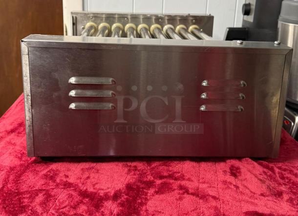 Hot Dog Roller Grill XCJ-9CZ-US with manual controls, slanted top, 120v. Stainless steel, good condition.