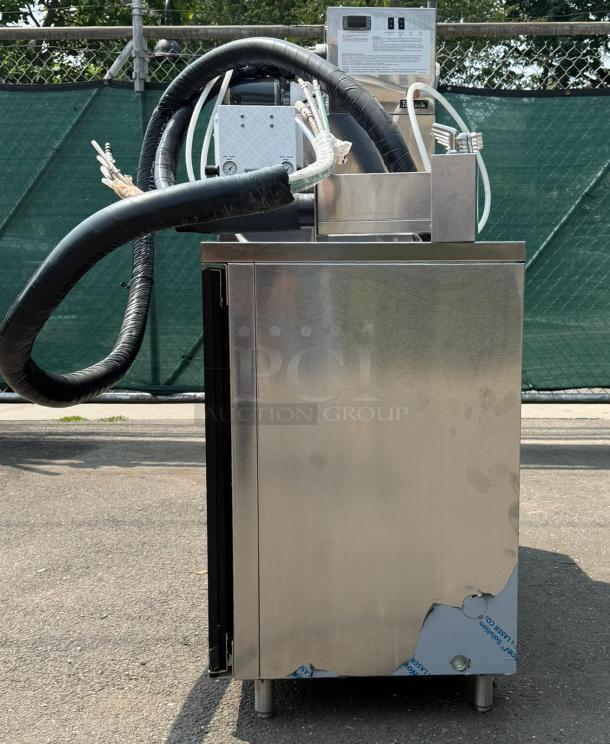 Perlick 4404 60" stainless steel beer dispenser, holds 5 quarter kegs, direct draw, excellent condition, hose attachments visible.