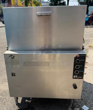 ET Series under counter dishwasher, low temp, single rack, with pumped drain. Visible control panel and model label. Good condition.