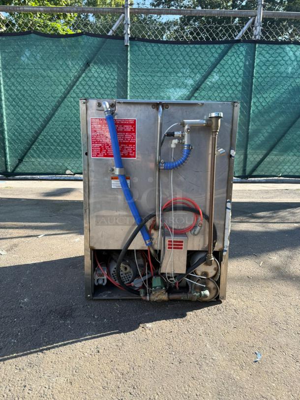 Wareforce UH30-E undercounter dishwasher, energy efficient, 208/230V. Visible plumbing and wiring. Good condition.