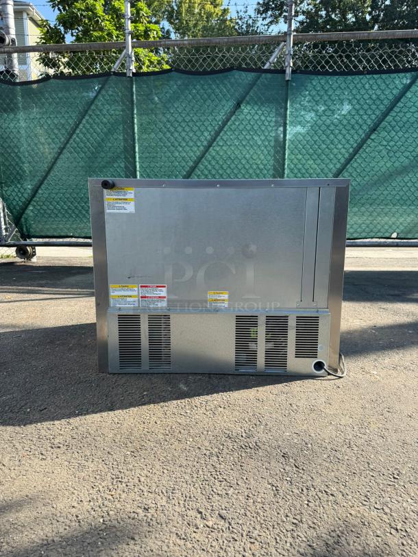 Beverage-Air UCR36AHC-23 36" undercounter refrigerator, stainless steel, visible labels and vents, outdoor setting.