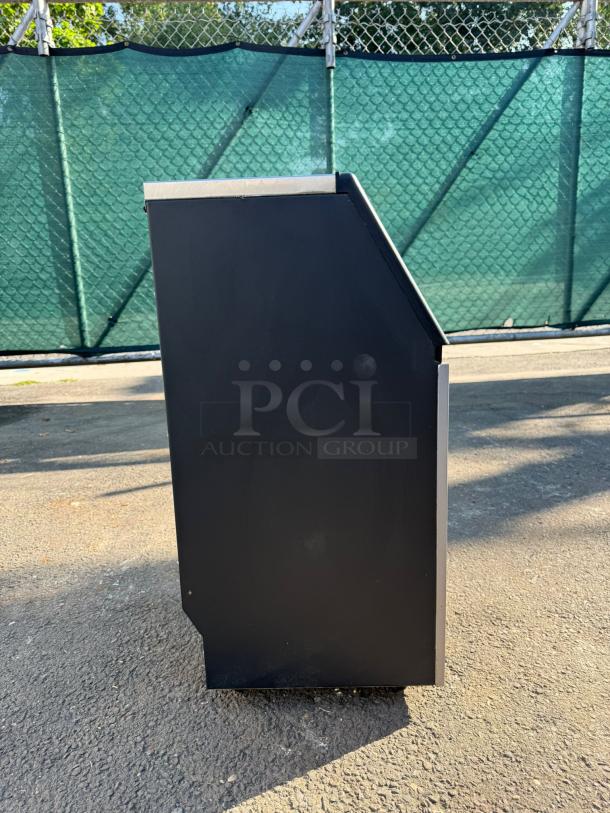 EUHOMY IM-02 commercial ice maker, black exterior, stainless steel top. 99lbs daily ice production. Freestanding/under-counter model.