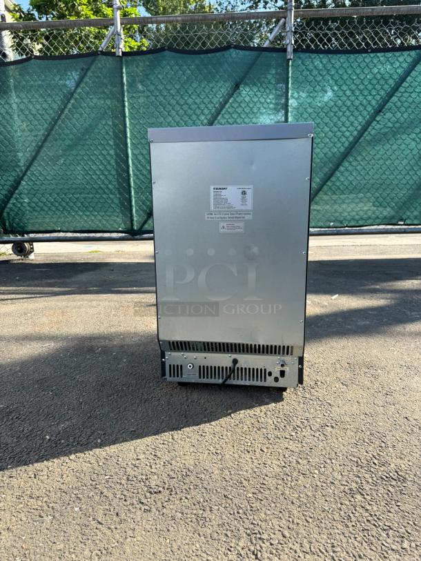 EUHOMY IM-02 commercial ice maker, stainless steel, 99lbs daily, 33lbs storage, visible label on back, outdoor setting.