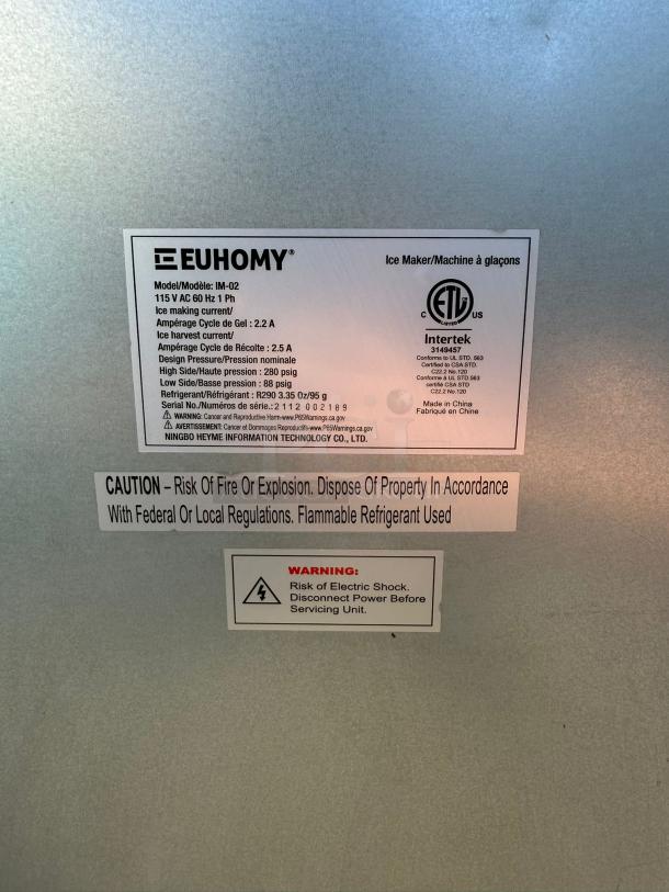EUHOMY IM-02 commercial ice maker label showing specifications: 99lbs daily production, 33lbs storage, stainless steel, ETL certified.