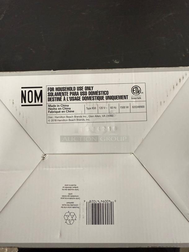 White packaging box for AICOK Coffee Maker CM4682-V. Labels indicate it's for household use, 120V, 1500W, made in China.