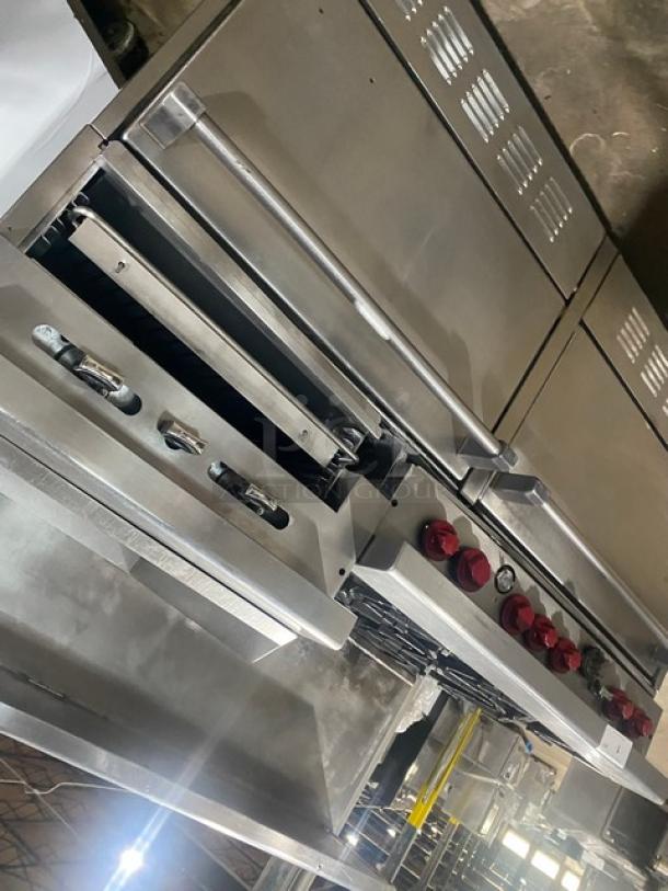 Garland H283 stainless steel 6-burner range with a raised flat griddle, double oven, broiler, backsplash, salamander shelf, and wired racks.