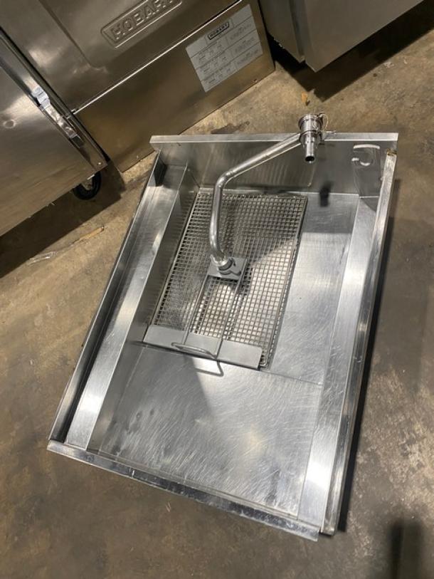 Pitco SSH60 stainless steel triple bay deep fryer with backsplash, basket hanger, natural gas-powered, on casters.