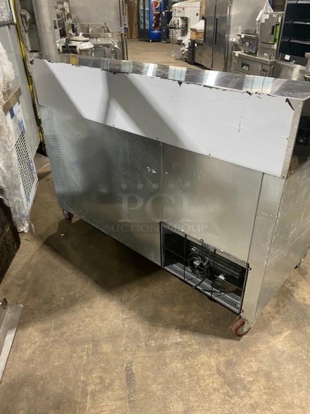 CoolTech 2022 stainless steel 2-door pizza prep table, model CTR-60DR, on casters, commercial use, visible wear.