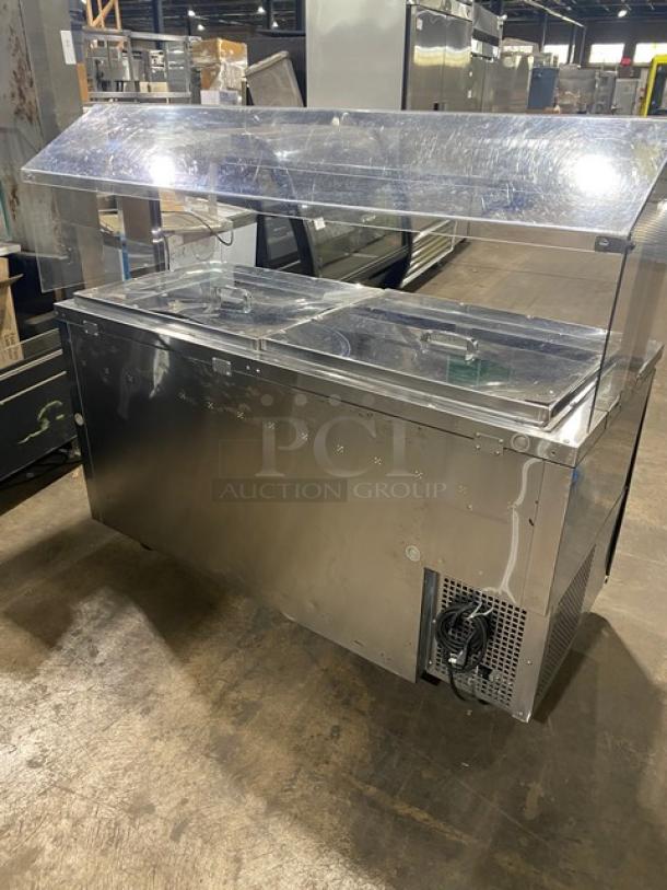 Turbo-Air JBT-60 refrigerated salad bar with sneeze guard, stainless steel, 2 doors, on casters, 115V, good condition.