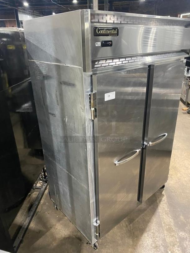 Continental 2RN stainless steel 2-door reach-in refrigerator, poly coated wire racks, 115V, on casters, good condition.