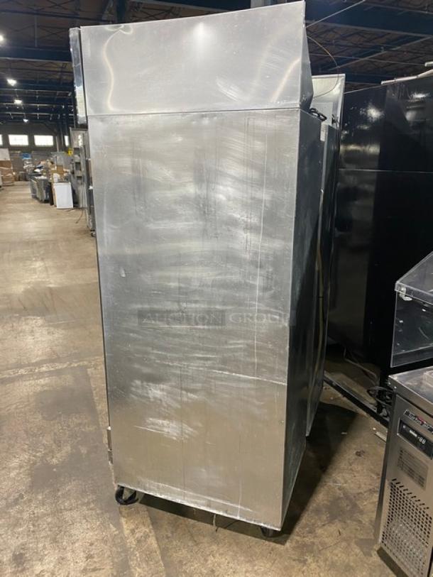 Continental 2RN stainless steel double door reach-in refrigerator with poly coated wire racks, on casters, 115V, 1-phase.