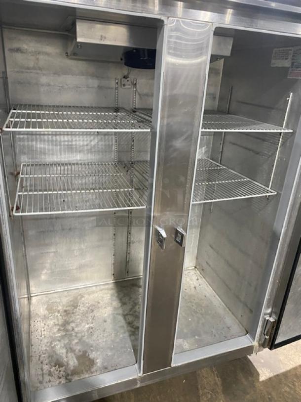 Continental 2RN stainless steel 2-door reach-in refrigerator, poly-coated wire racks, on casters, model 2RN.
