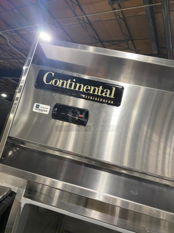 Continental Commercial Stainless Steel 2 Door Fridge, Model 2RN, with poly coated racks, 115V, on casters, labels visible.