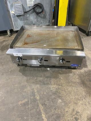 Cook Rite stainless steel commercial griddle, natural gas, with back and side splash, on legs. Used condition.