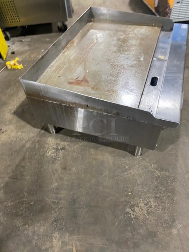 Cook Rite stainless steel natural gas countertop griddle, features back and side splash, on legs, used condition.