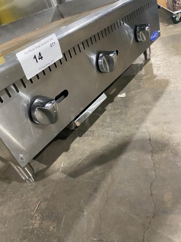 Cook Rite Atosa stainless steel gas countertop griddle with back and side splash, mounted on legs, in good condition.